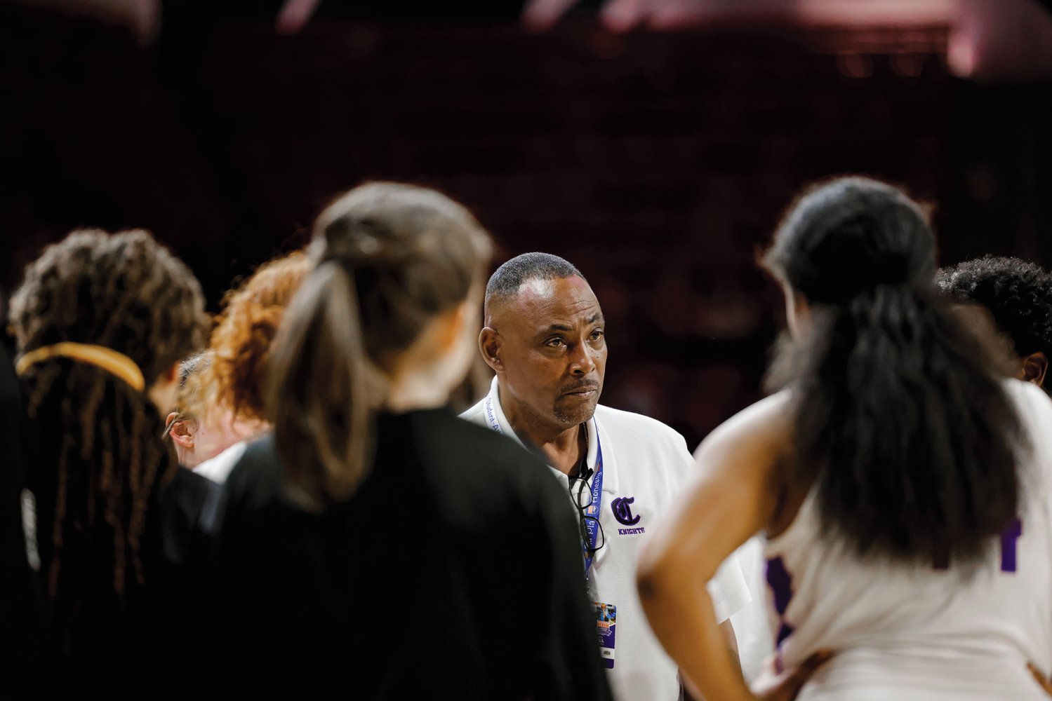 Chatham Charter head coach Jeff Patterson speaks with his team during its 73-43 loss to Bishop McGuinness in the 1A girls state final Saturday.